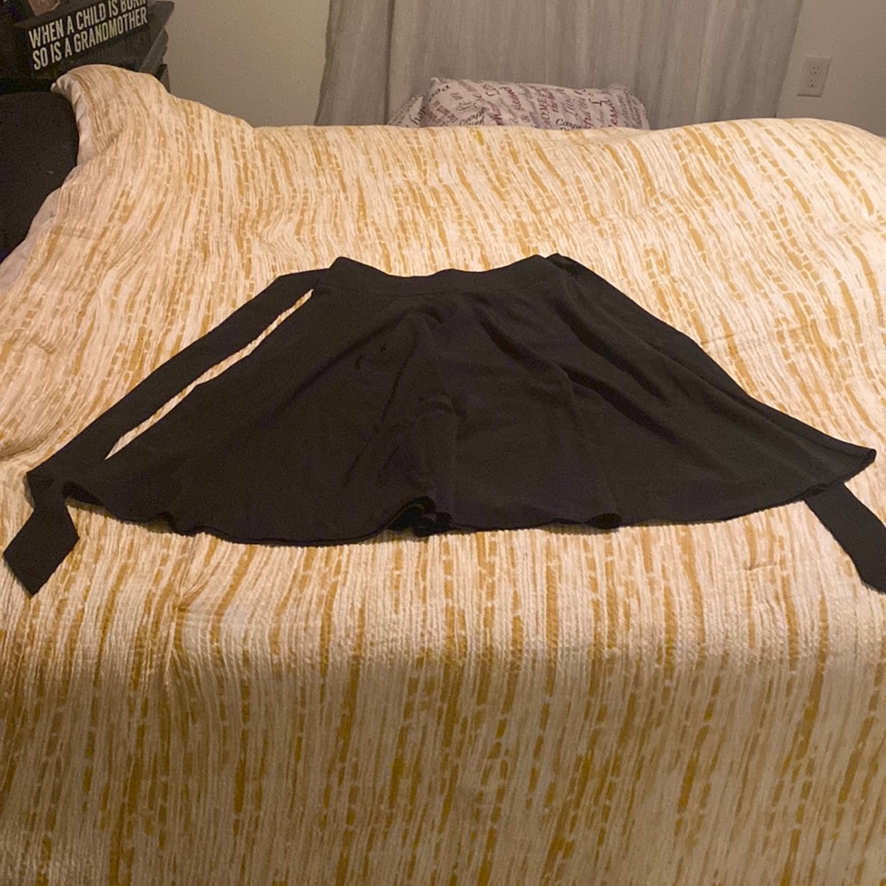 Black A-line, belted skirts.